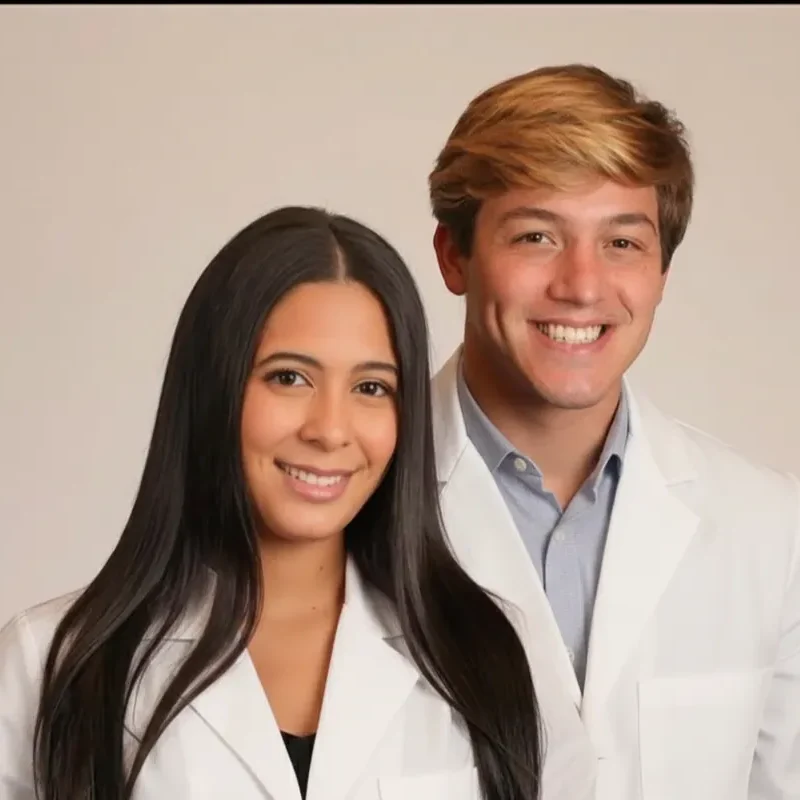 Dr. Jeremy Milite & Dr. Lauren DePinter in white coats.