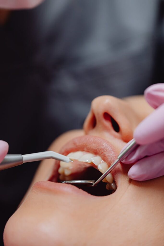 pexels-photo-6627524-6627524 Close-up of dental procedure highlighting hygiene and patient care.